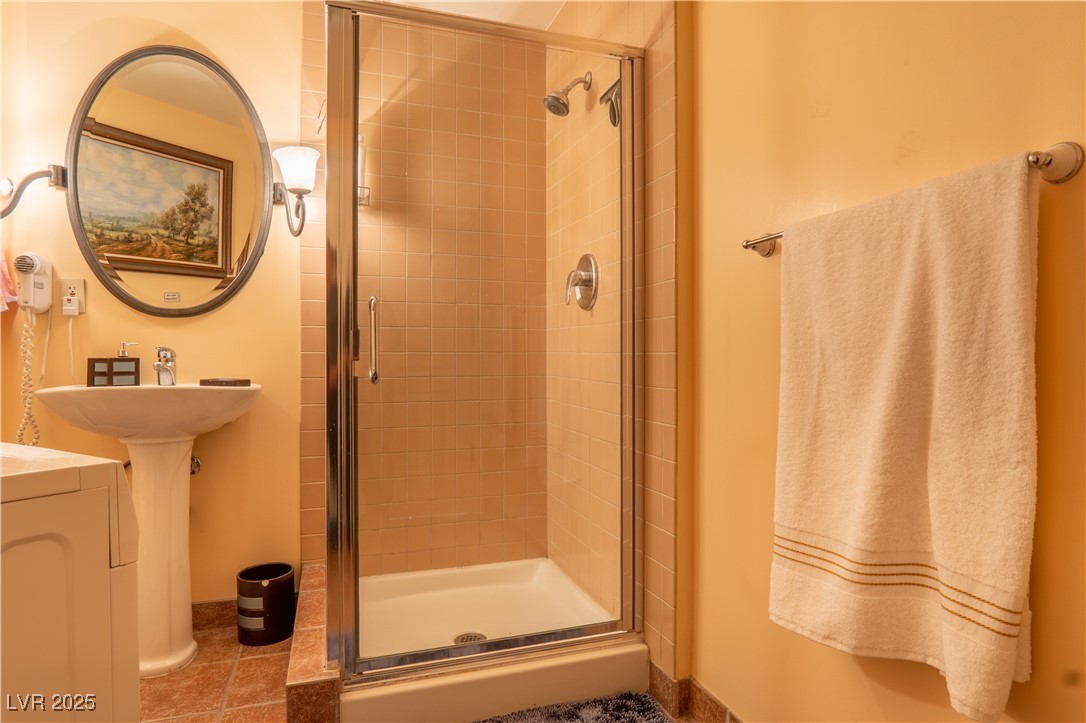 30 Strada Di Villaggio, Unit 617 Henderson, NV 89011 - Photo 17 of 34 Full bathroom featuring a stall shower and tile patterned flooring
