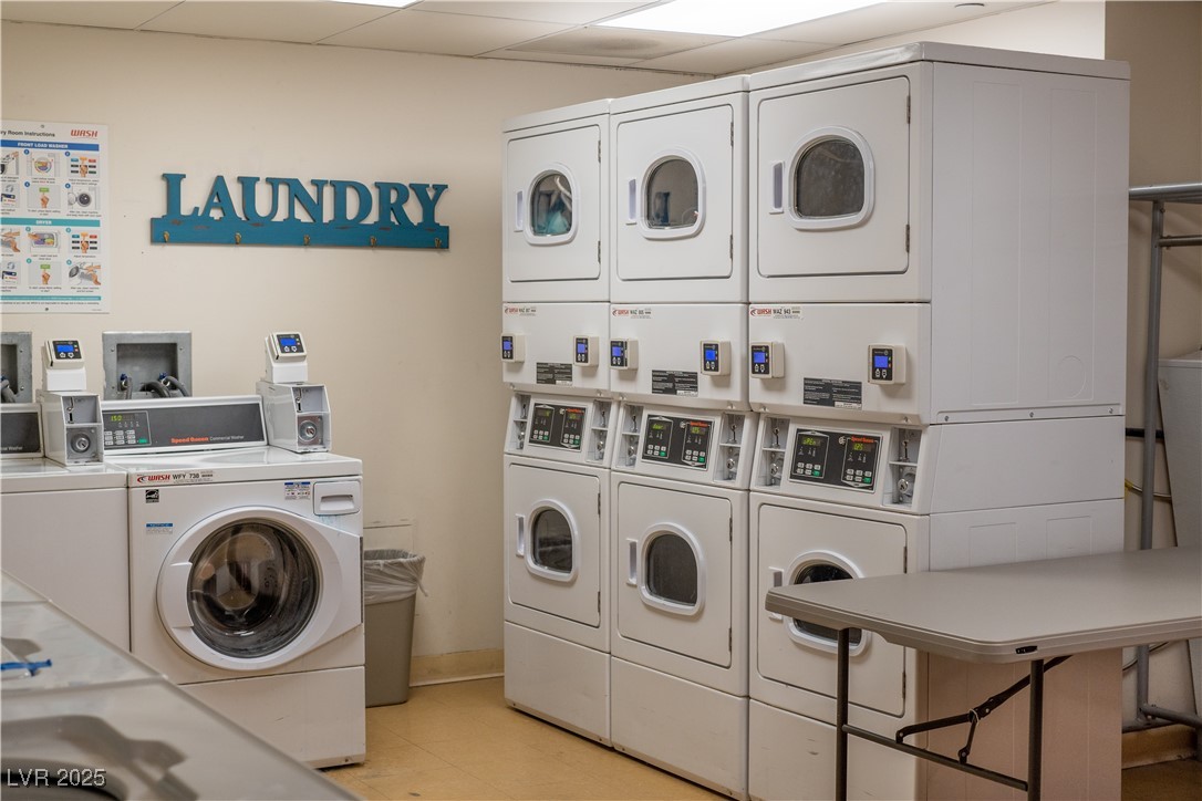 30 Strada Di Villaggio, Unit 617 Henderson, NV 89011 - Photo 18 of 34 Communal laundry room with estacked washer and dryer and light tile patterned floors