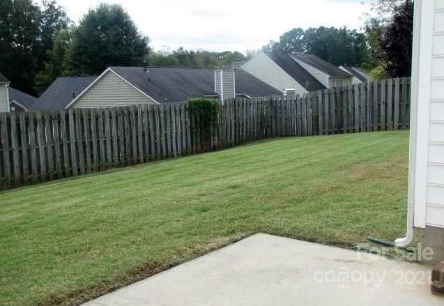 9336 Culcairn Road Huntersville, NC 28078 - Photo 2 of 7 a view of a backyard with a garden