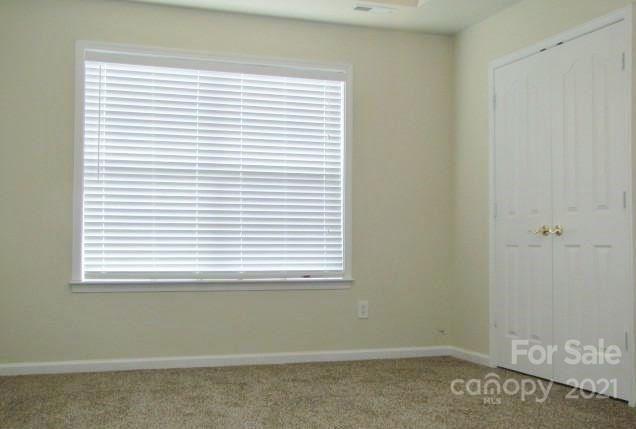 9336 Culcairn Road Huntersville, NC 28078 - Photo 4 of 7 an empty room with a window