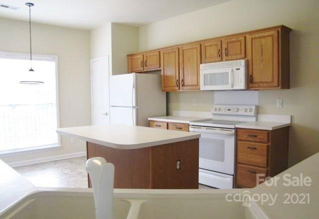 9336 Culcairn Road Huntersville, NC 28078 - Photo 7 of 7 a kitchen with stainless steel appliances a sink stove and refrigerator