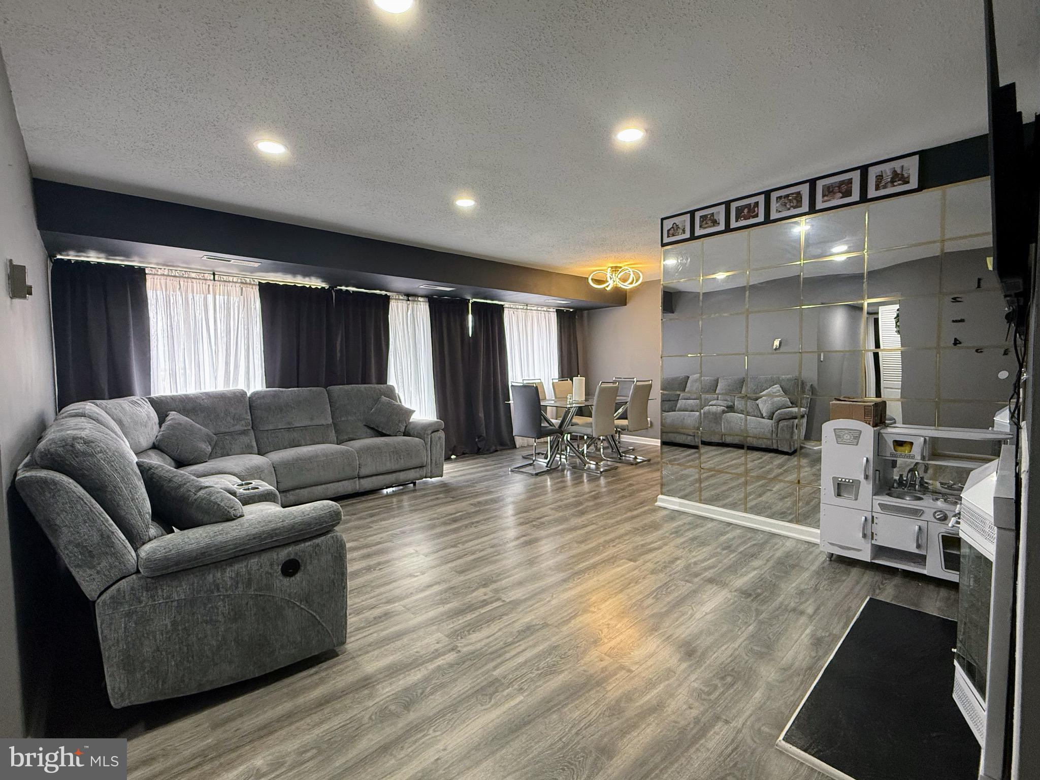 a living room with furniture and a table