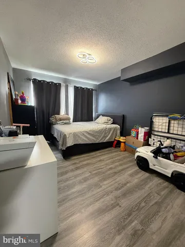 a bedroom with two beds and a couch