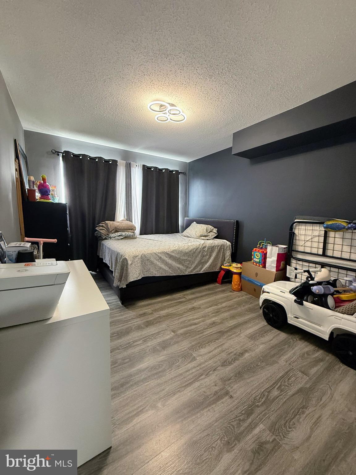 5831 Quantrell Avenue, Unit 505 Alexandria, VA 22312 - Photo 12 of 22 a bedroom with two beds and a couch