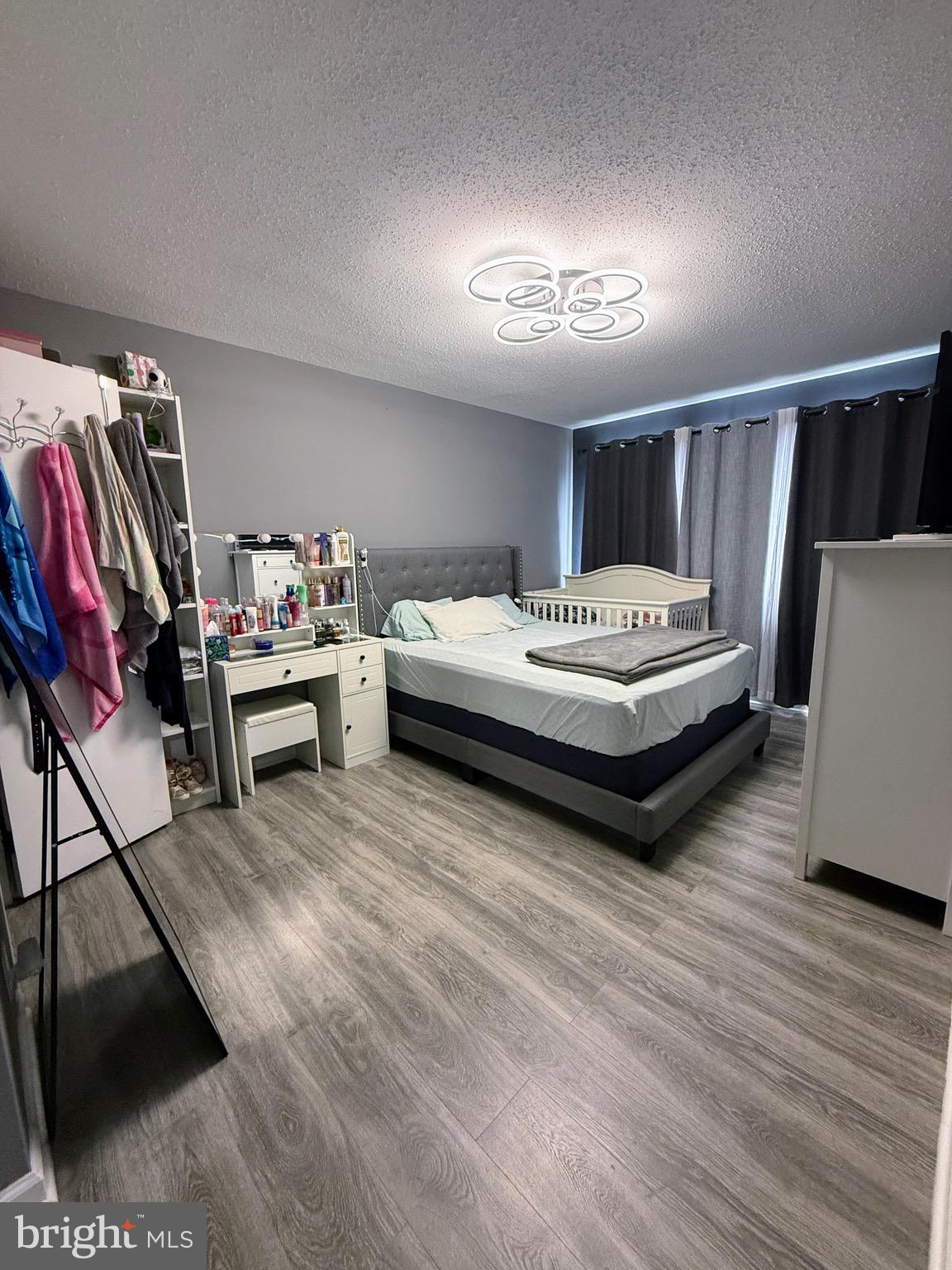 5831 Quantrell Avenue, Unit 505 Alexandria, VA 22312 - Photo 14 of 22 a spacious bedroom with a bed and a view of bedroom