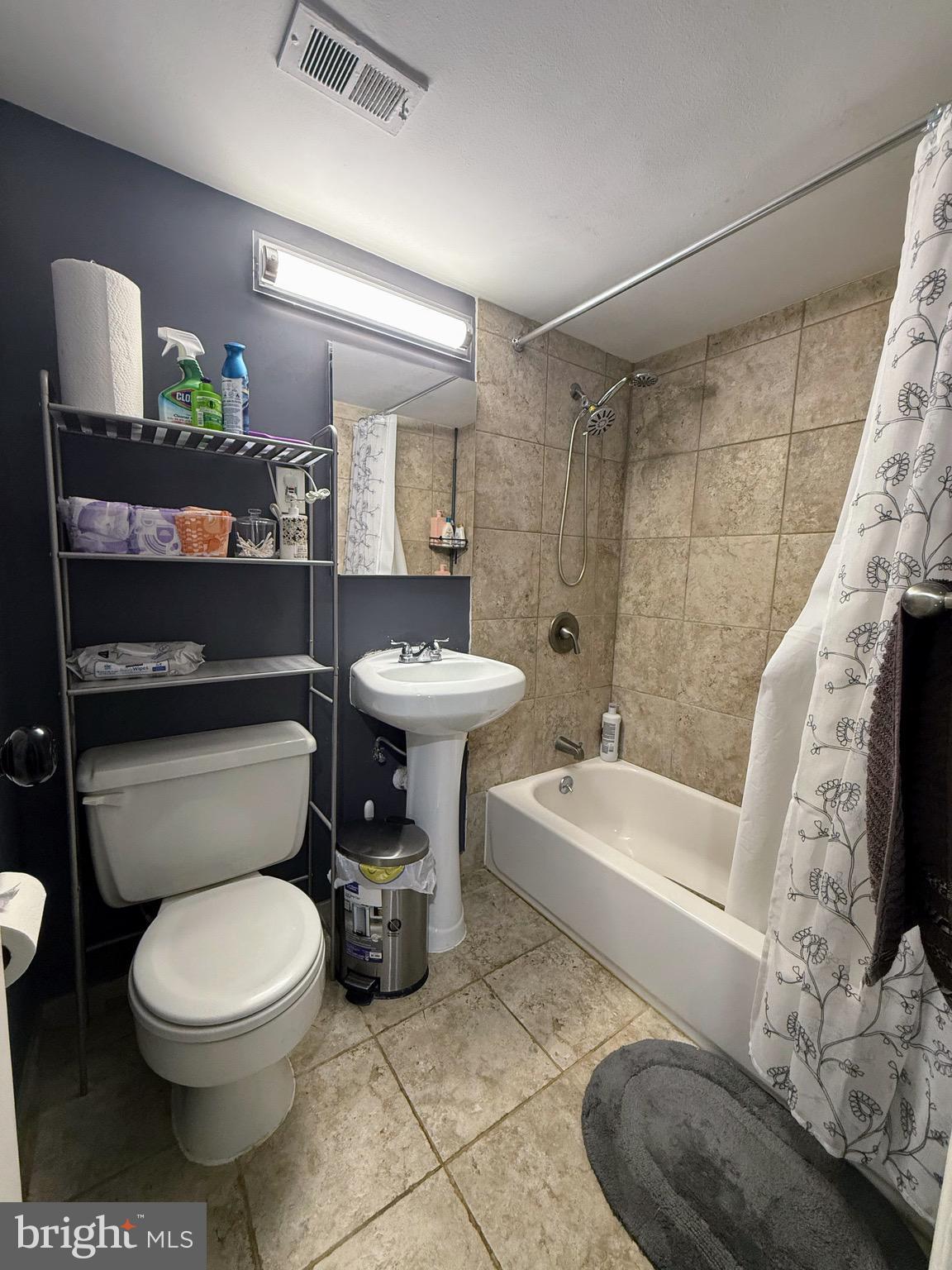 5831 Quantrell Avenue, Unit 505 Alexandria, VA 22312 - Photo 16 of 22 a white toilet sitting next to a bathroom sink and a tub