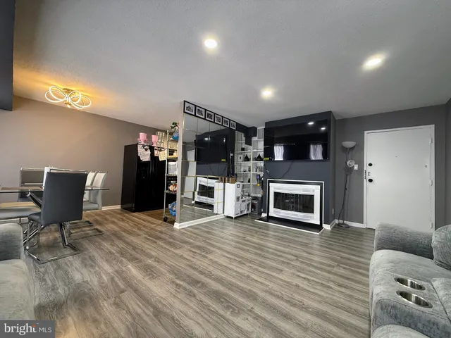 a view of a livingroom with furniture and a fireplace
