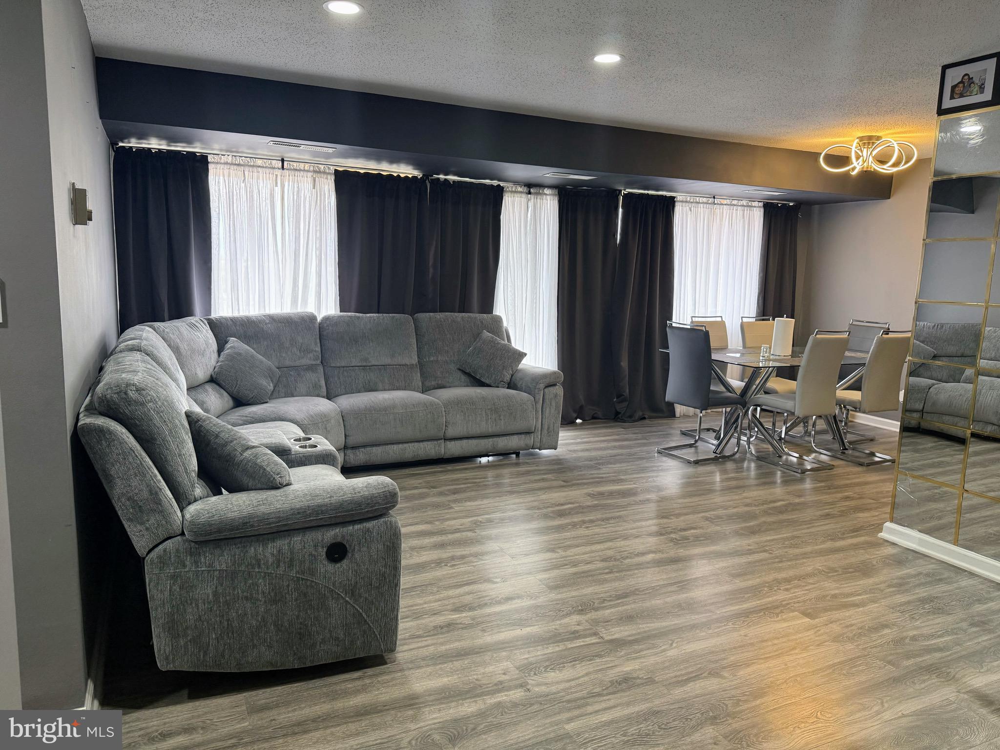 5831 Quantrell Avenue, Unit 505 Alexandria, VA 22312 - Photo 2 of 22 a living room with furniture and a large window