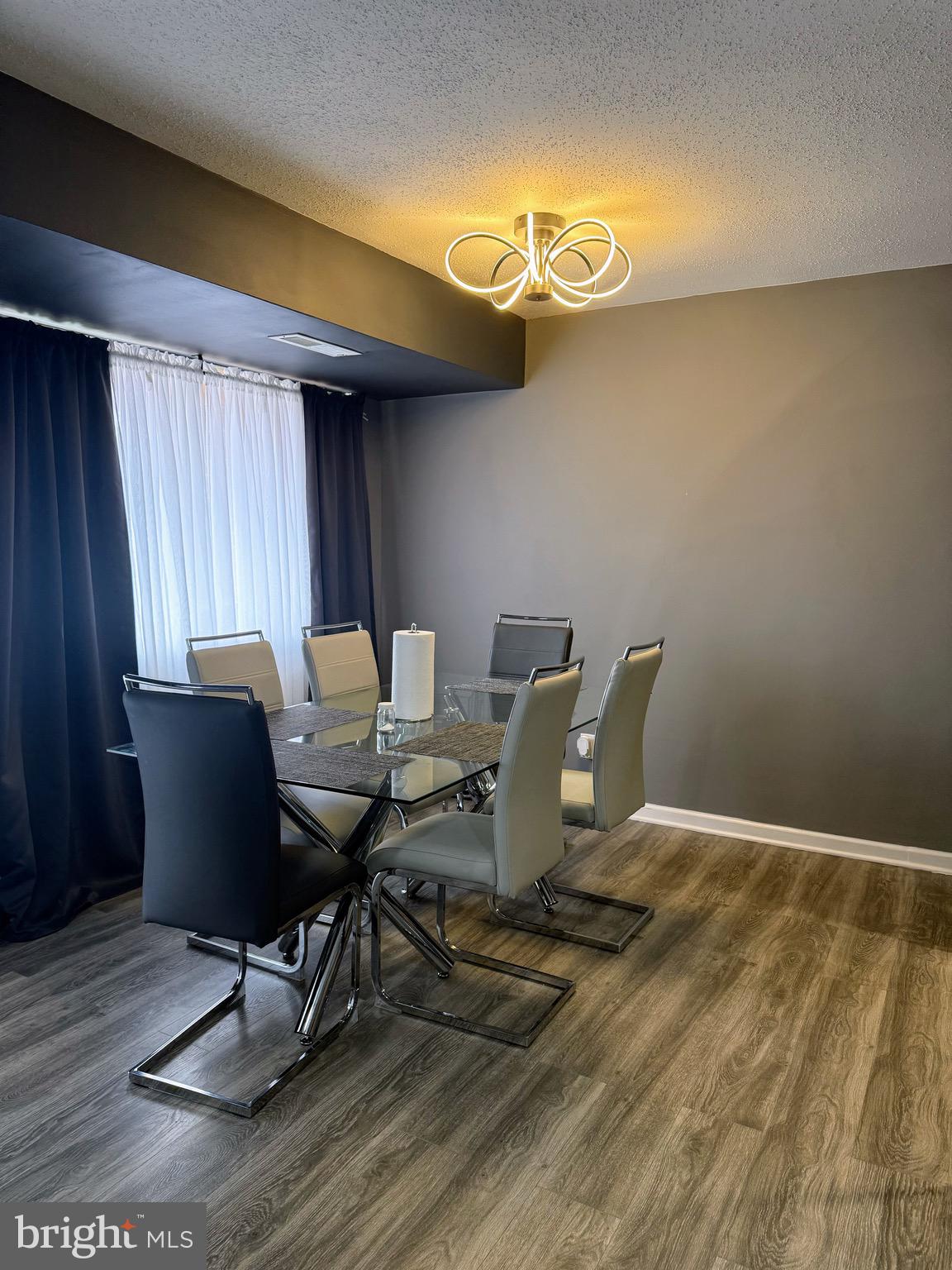 5831 Quantrell Avenue, Unit 505 Alexandria, VA 22312 - Photo 5 of 22 a workspace with furniture and chandelier