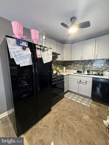 a kitchen with a sink a stove and refrigerator