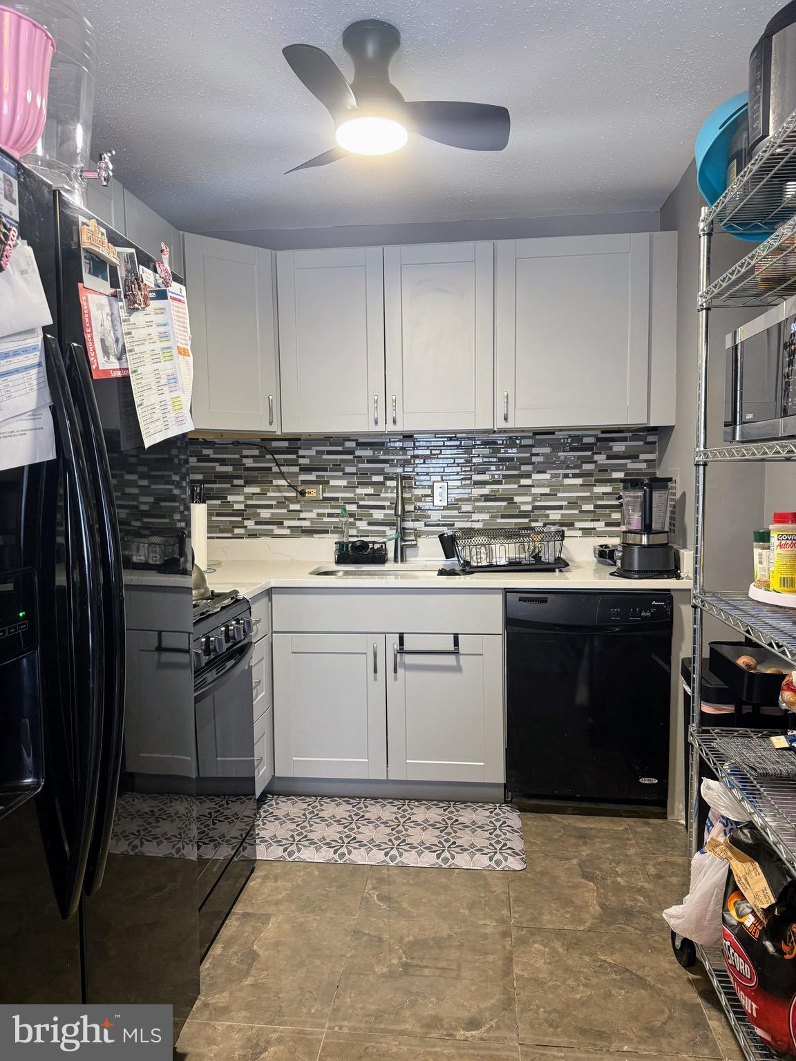5831 Quantrell Avenue, Unit 505 Alexandria, VA 22312 - Photo 8 of 22 a kitchen with a stove and a refrigerator