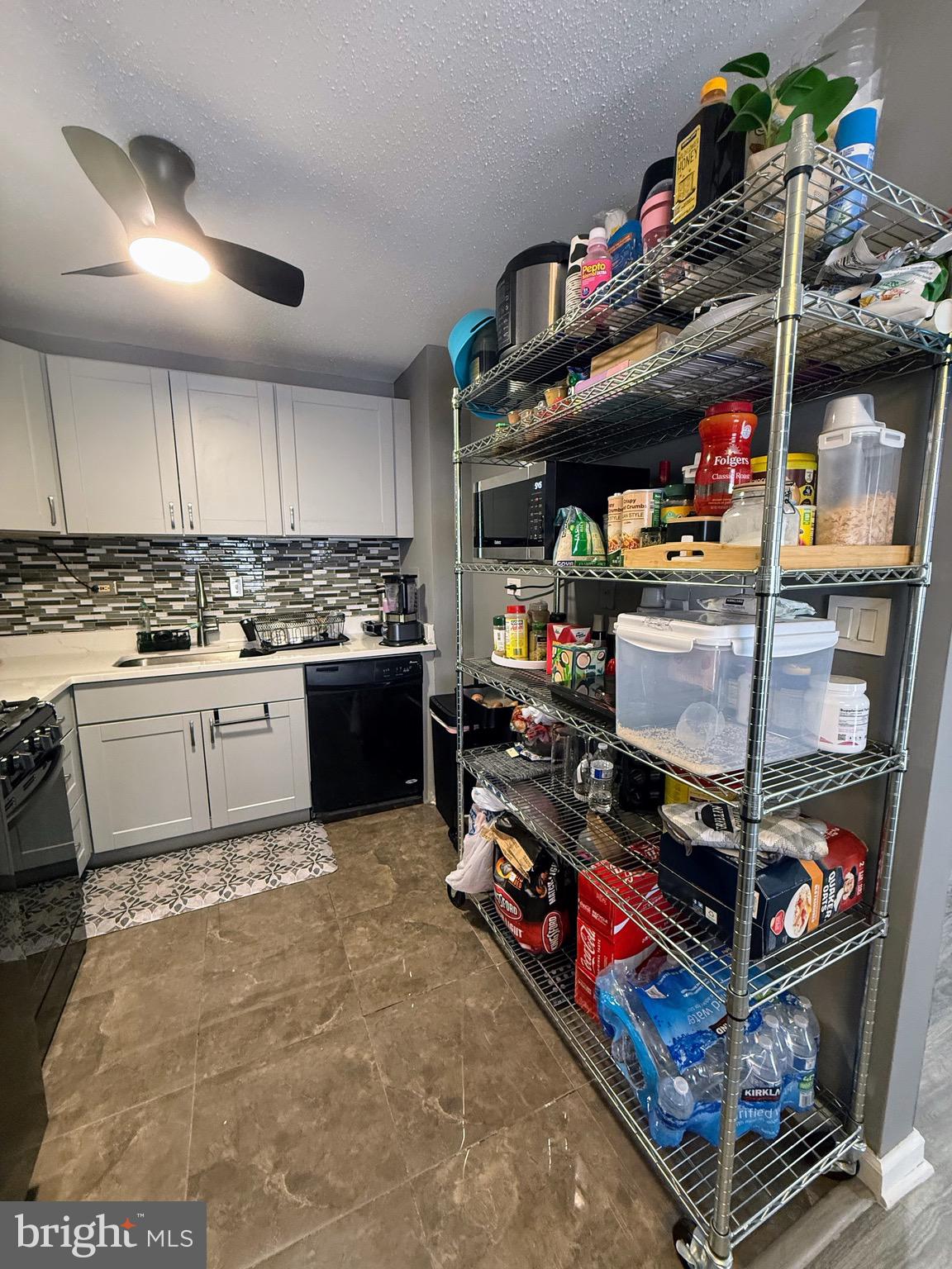 5831 Quantrell Avenue, Unit 505 Alexandria, VA 22312 - Photo 9 of 22 a kitchen with stainless steel appliances granite countertop a sink and cabinets