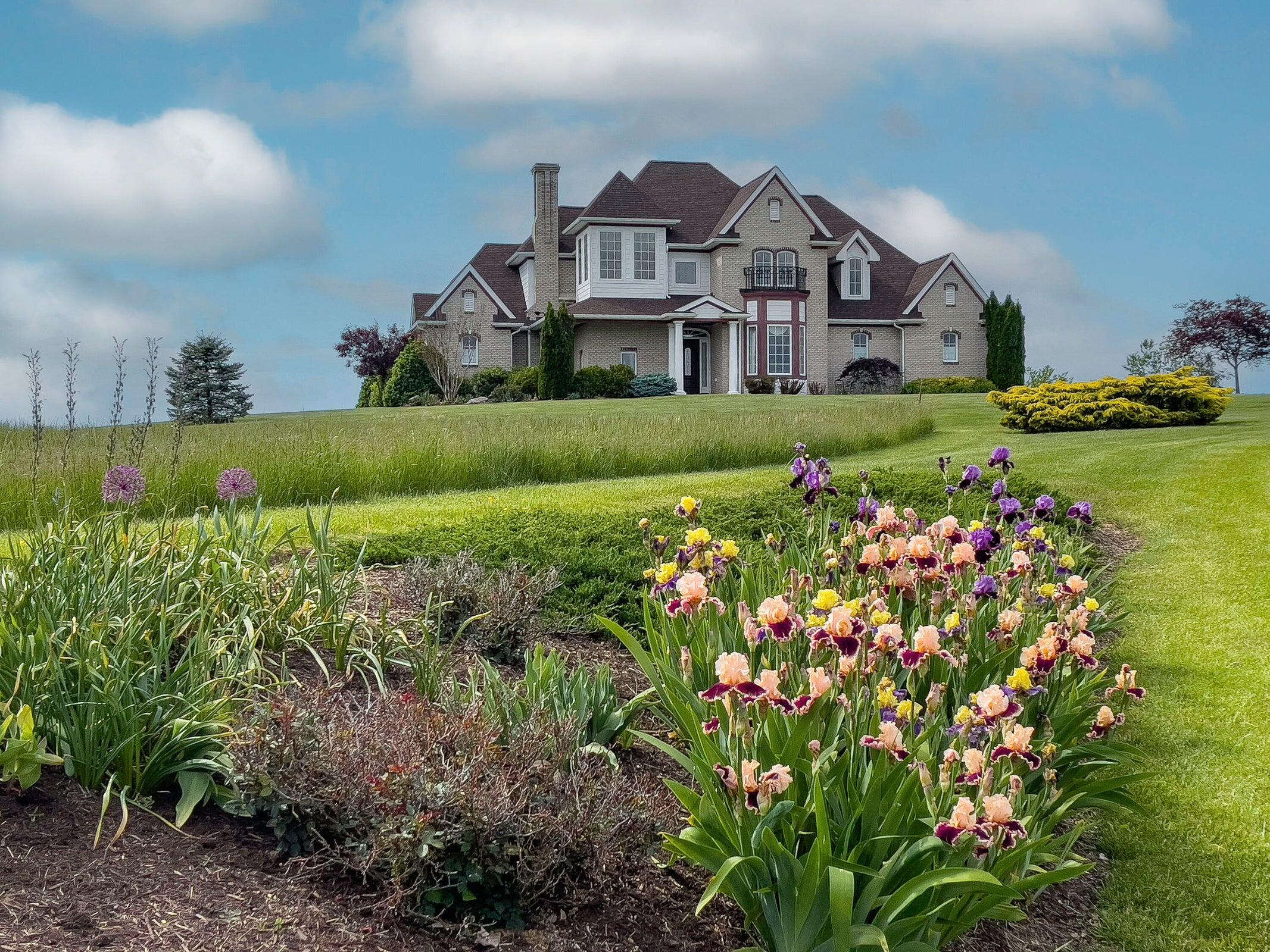 1875 Ridge Road Raphine, VA 24472 - Photo 1 of 72 a front view of a house with a big yard and large trees