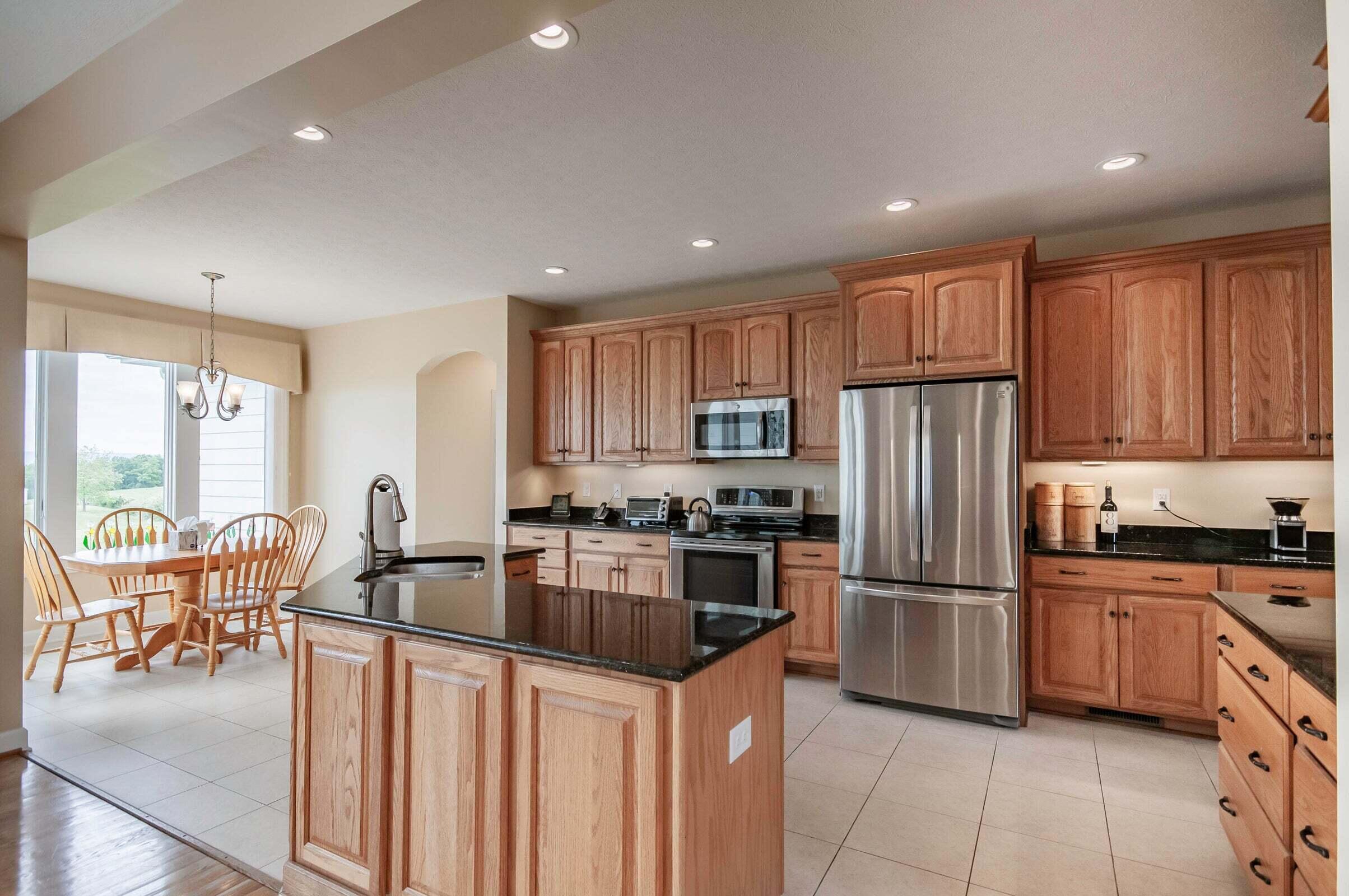 1875 Ridge Road Raphine, VA 24472 - Photo 25 of 72 a kitchen with granite countertop a refrigerator and a stove top oven