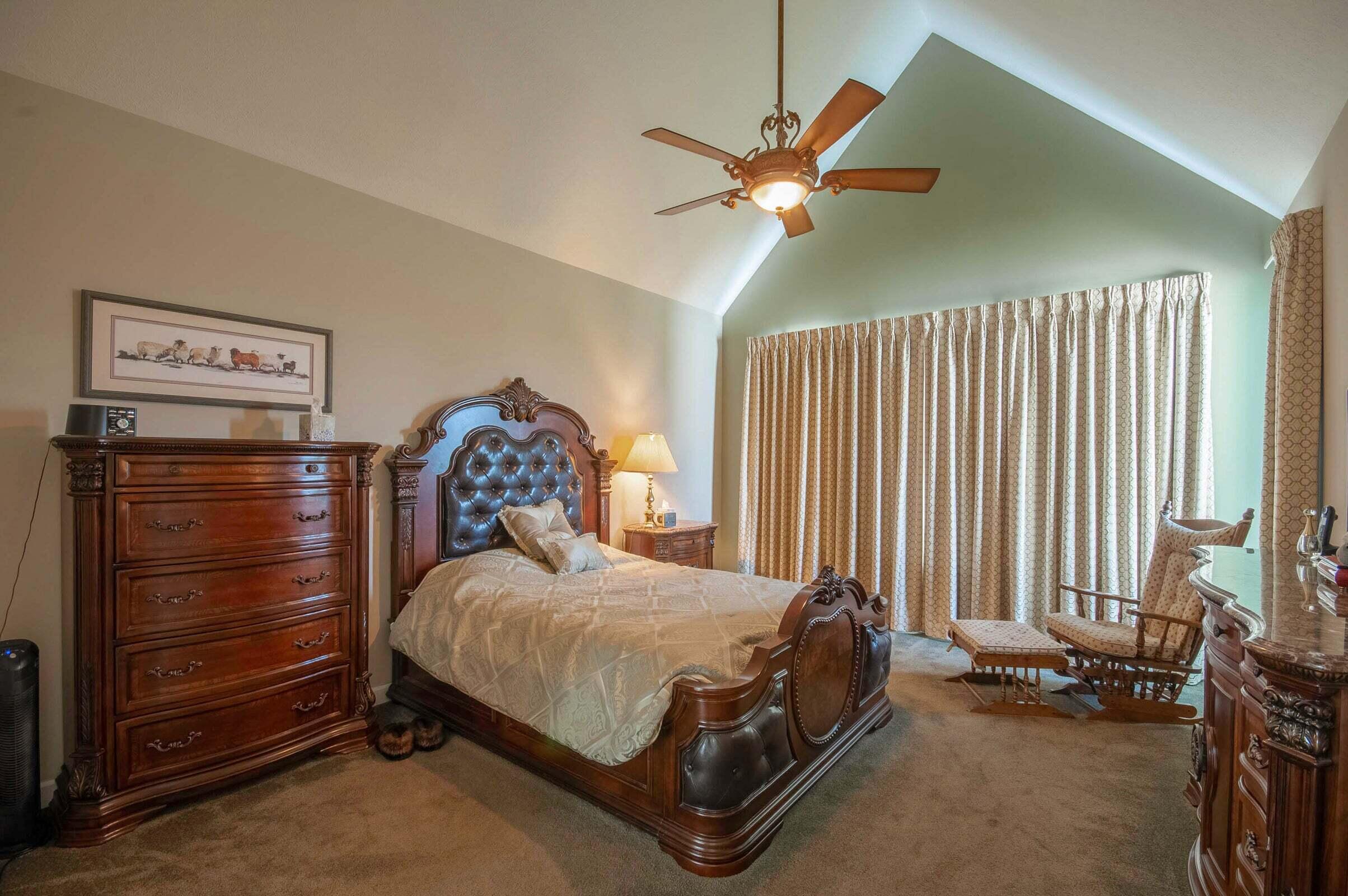 1875 Ridge Road Raphine, VA 24472 - Photo 35 of 72 a bedroom with a bed and a chandelier