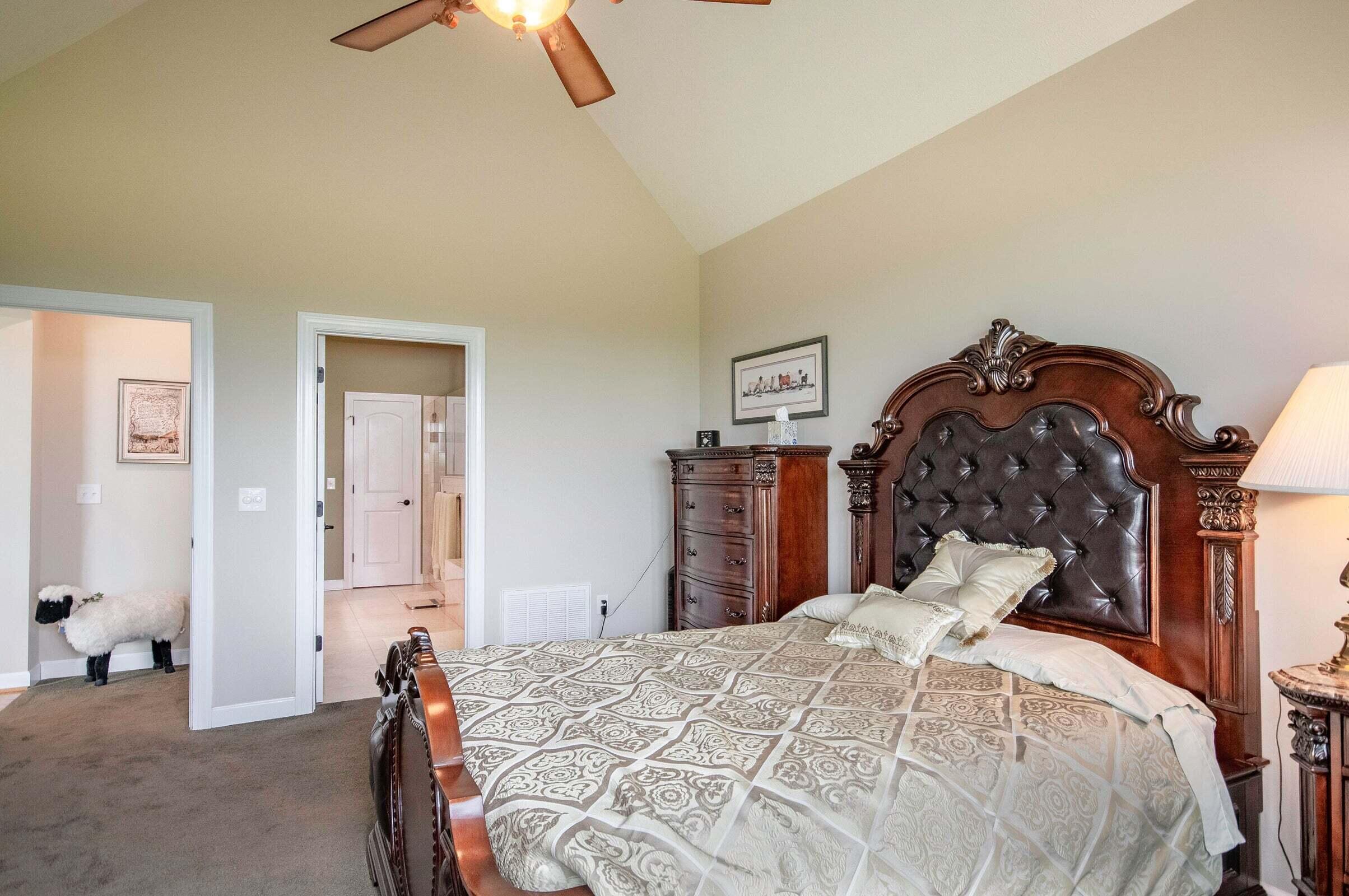 1875 Ridge Road Raphine, VA 24472 - Photo 36 of 72 a bedroom with a bed and a chandelier