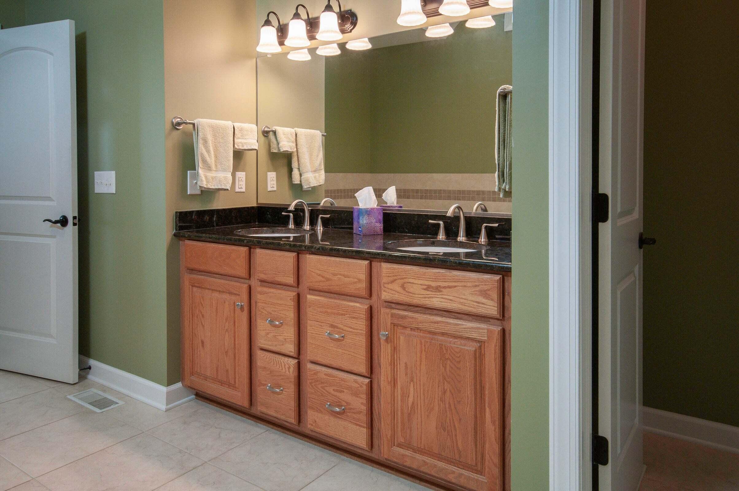 1875 Ridge Road Raphine, VA 24472 - Photo 40 of 72 a bathroom with a double vanity sink and a mirror