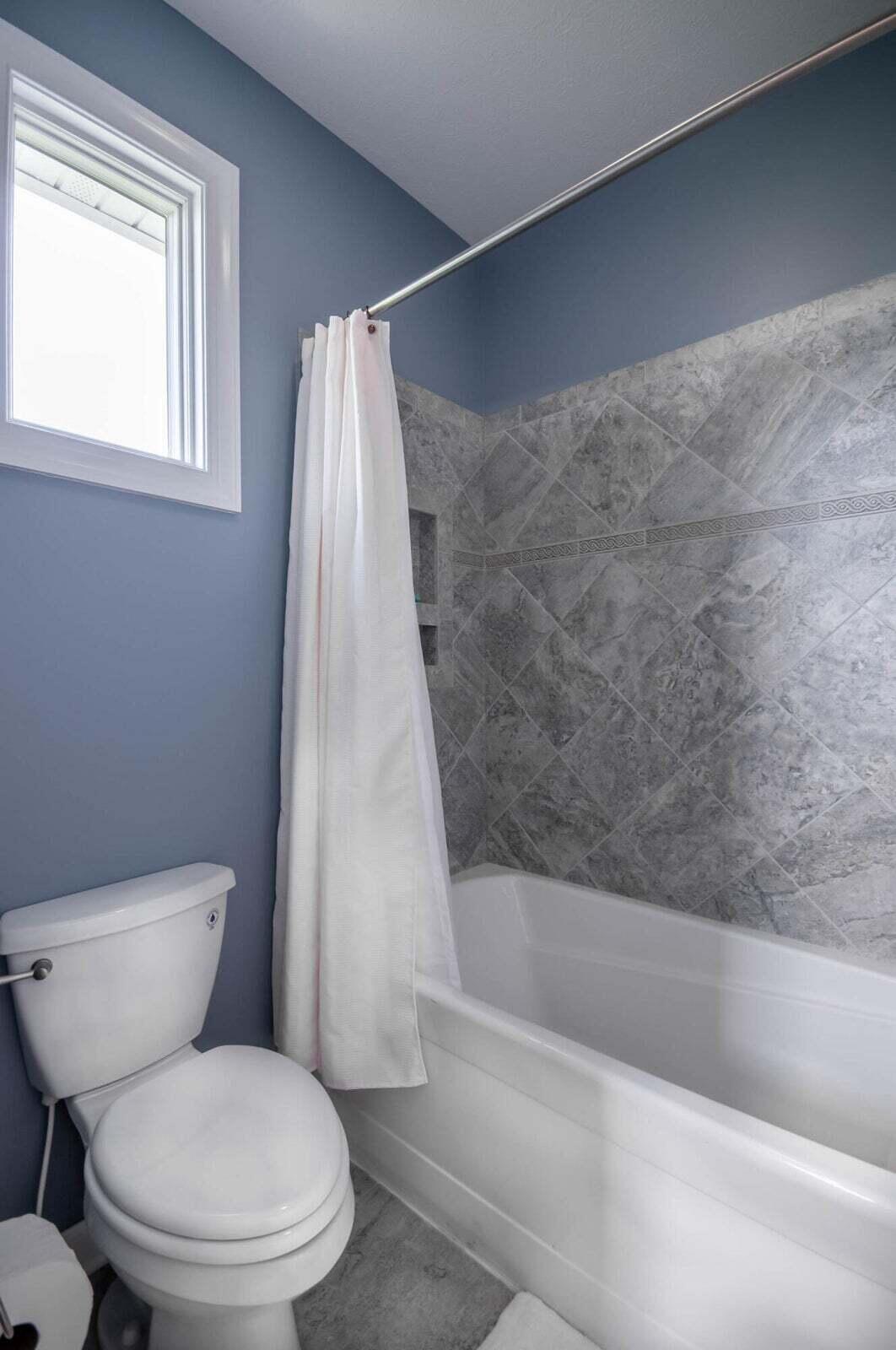 1875 Ridge Road Raphine, VA 24472 - Photo 45 of 72 a white toilet sitting next to a bath tub