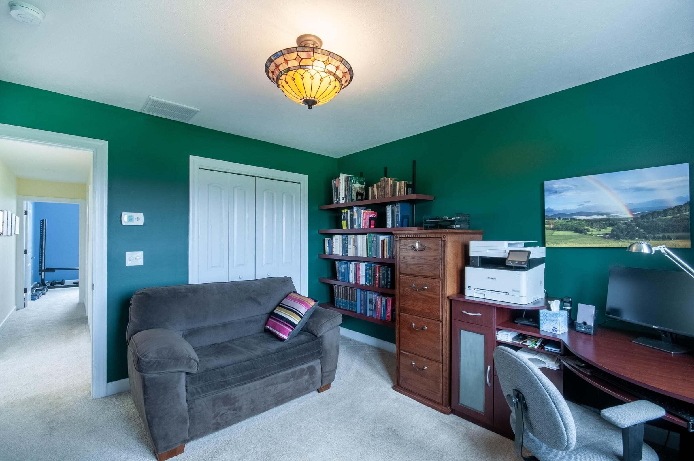 1875 Ridge Road Raphine, VA 24472 - Photo 53 of 72 a living room with furniture and a bookshelf