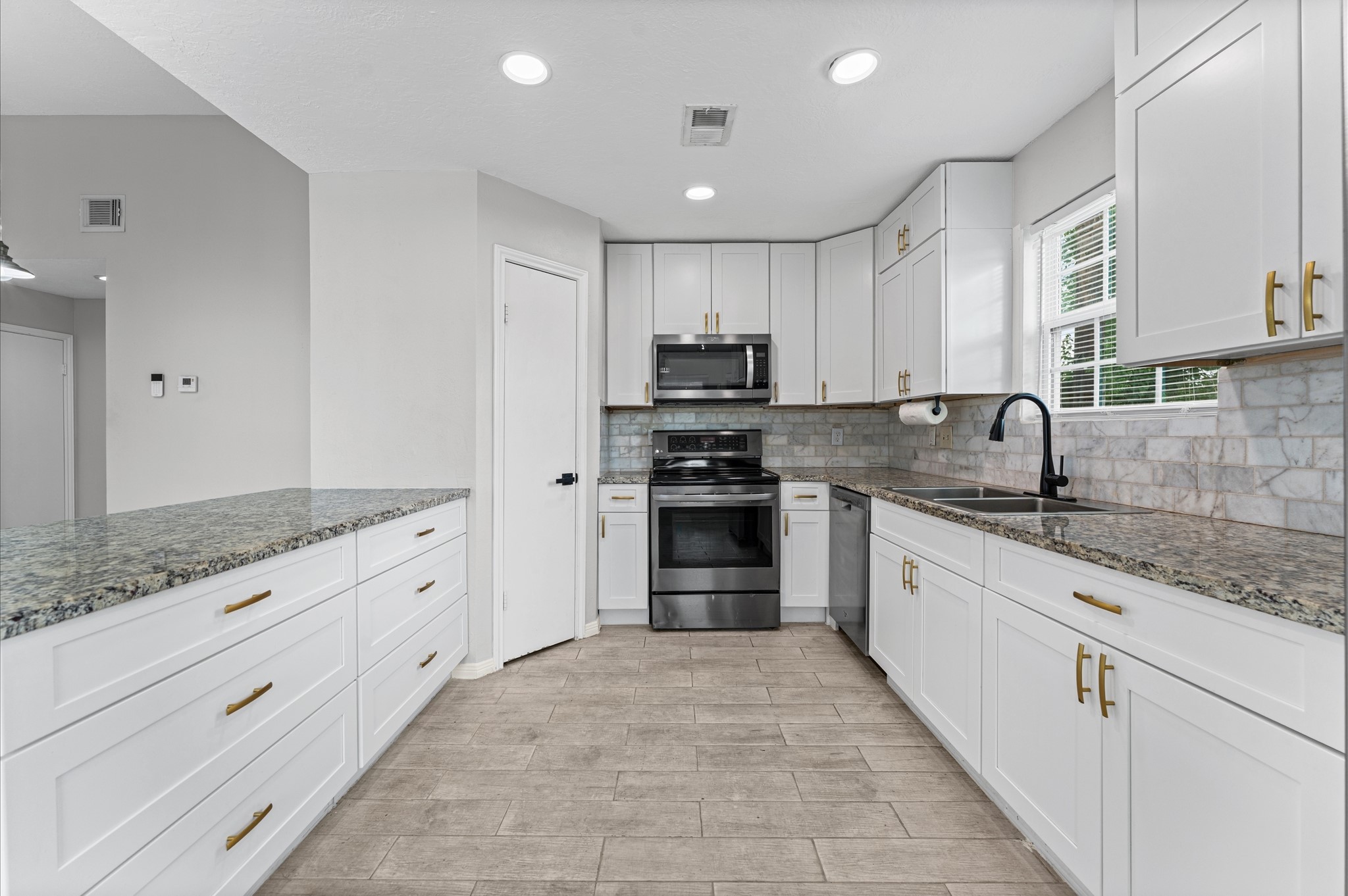 7810 Poitiers Drive Houston, TX 77071 - Photo 8 of 29 Soft closing cabinets, tall ceilings, recessed lighting, great prep area with plenty of counter space! Ideal for entertaining.