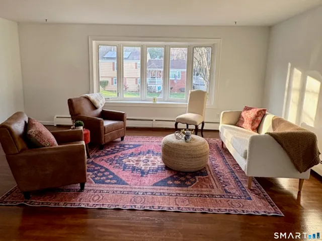a living room with furniture and a rug