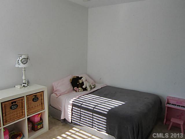 435 Third Baxter Street Fort Mill, SC 29708 - Photo 5 of 12 a bedroom with a bed and a cabinets