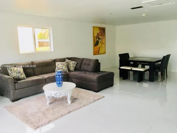 a living room with furniture and a couch