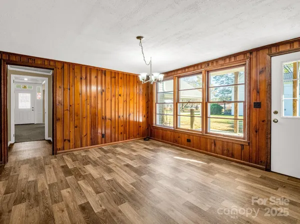 a kitchen with stainless steel appliances granite countertop a stove a sink dishwasher and a refrigerator