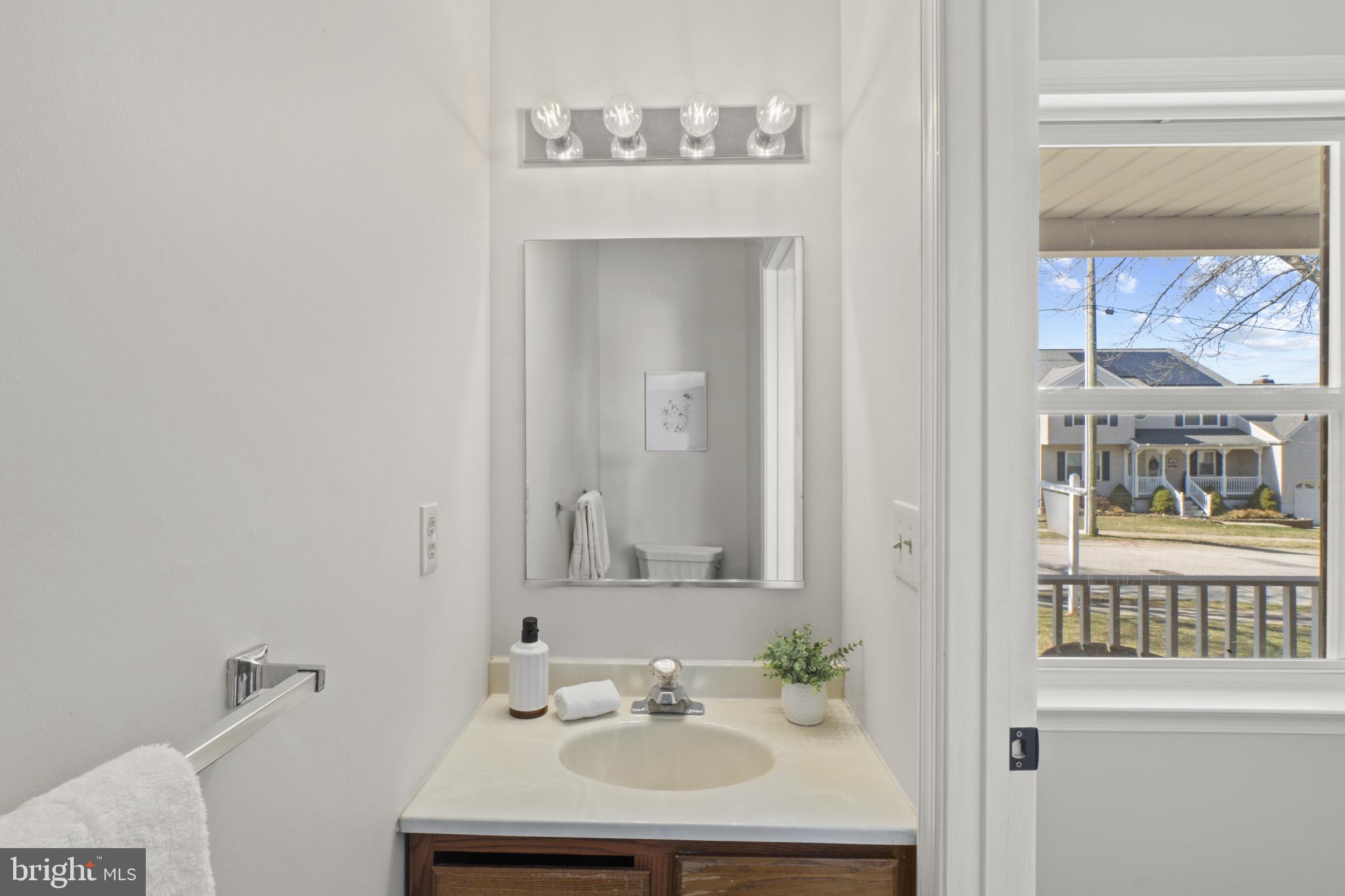 607 Brentwood Road Linthicum Heights, MD 21090 - Photo 14 of 31 a bathroom with a sink and a mirror