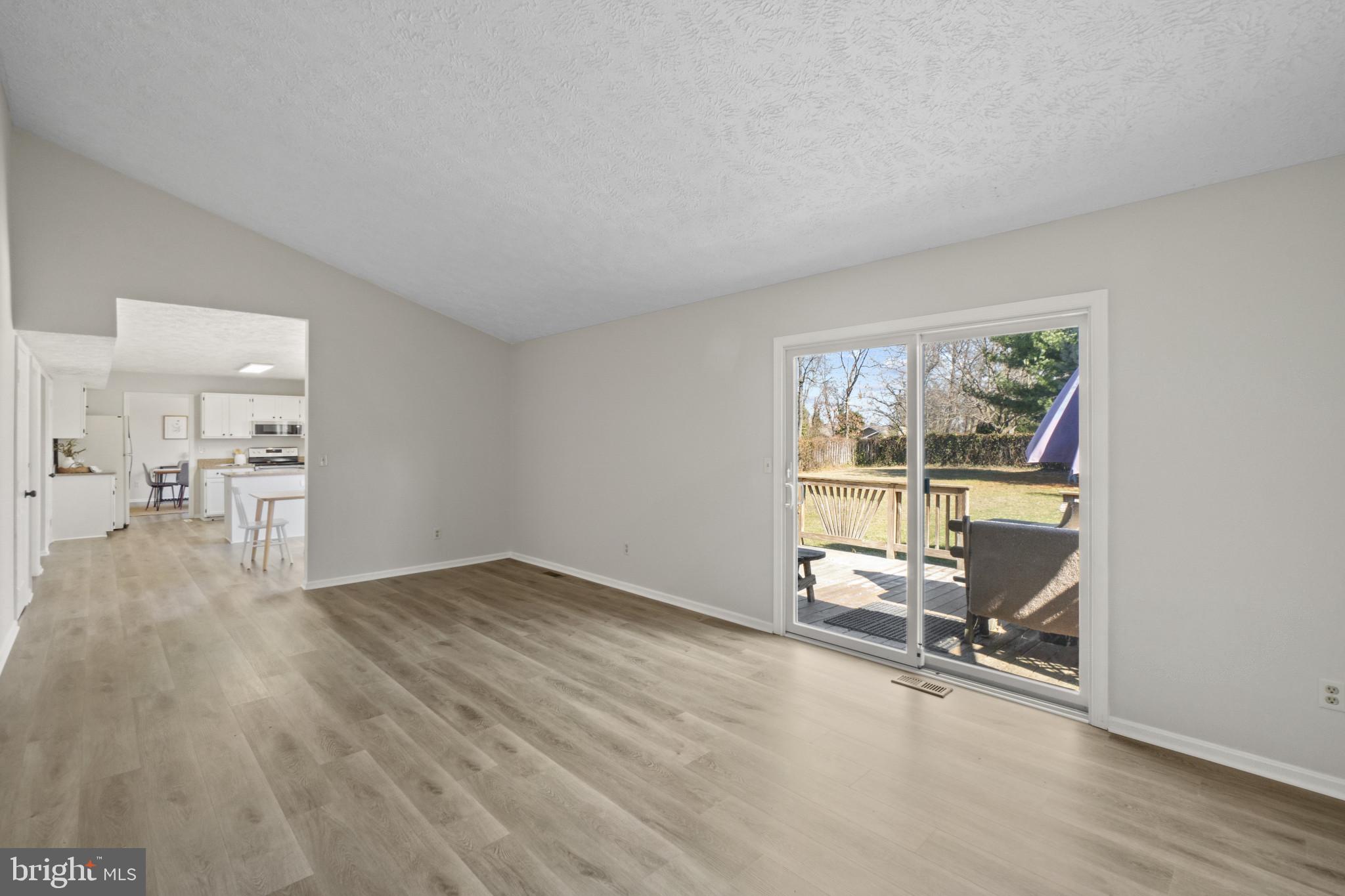 607 Brentwood Road Linthicum Heights, MD 21090 - Photo 15 of 31 an empty room with wooden floor and a window