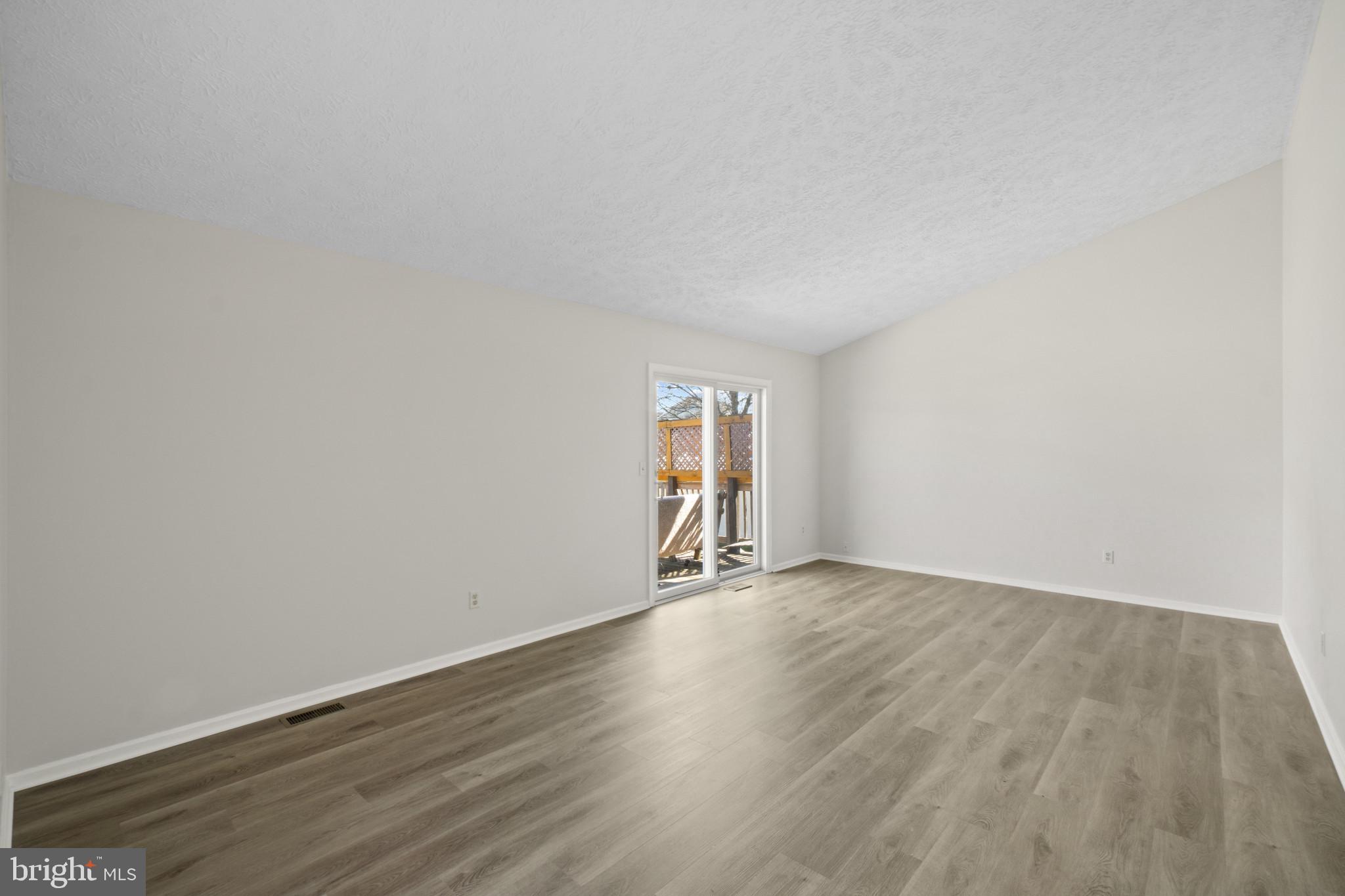607 Brentwood Road Linthicum Heights, MD 21090 - Photo 16 of 31 an empty room with wooden floor and window