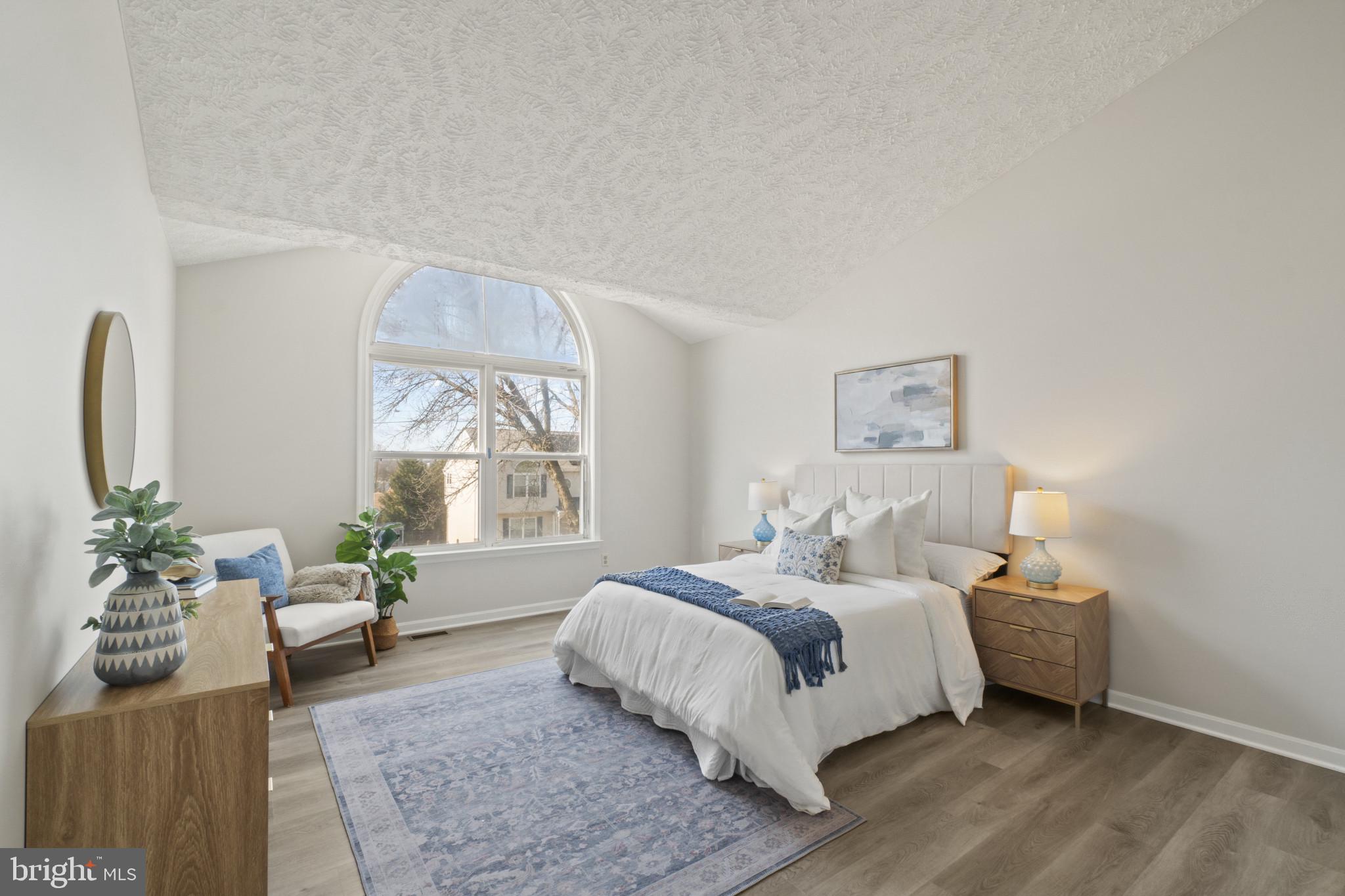 607 Brentwood Road Linthicum Heights, MD 21090 - Photo 21 of 31 a bedroom with a large bed and a couch