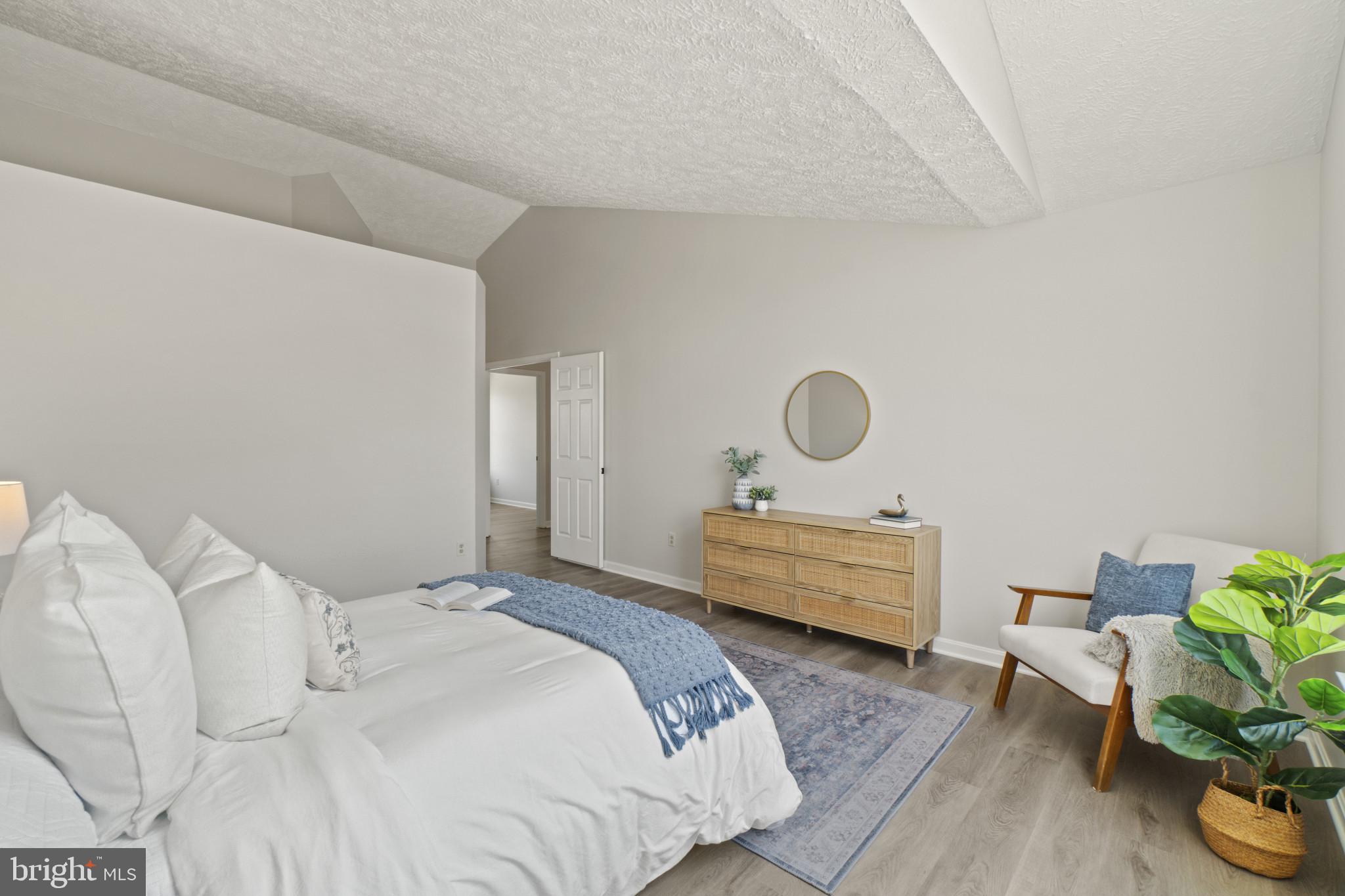 607 Brentwood Road Linthicum Heights, MD 21090 - Photo 22 of 31 a bedroom with a bed and a table