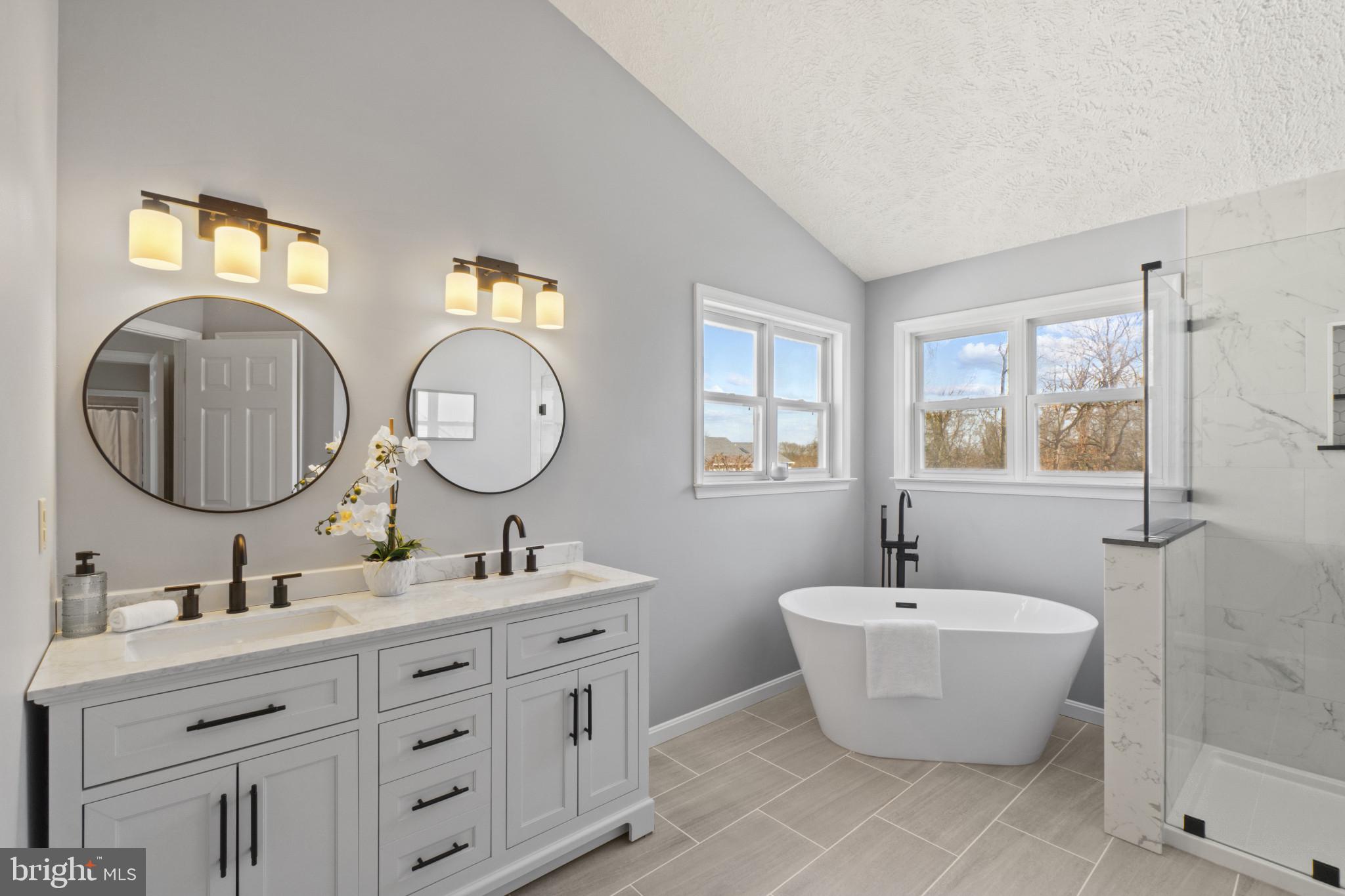 607 Brentwood Road Linthicum Heights, MD 21090 - Photo 24 of 31 a bathroom with a double vanity sink mirror and bathtub