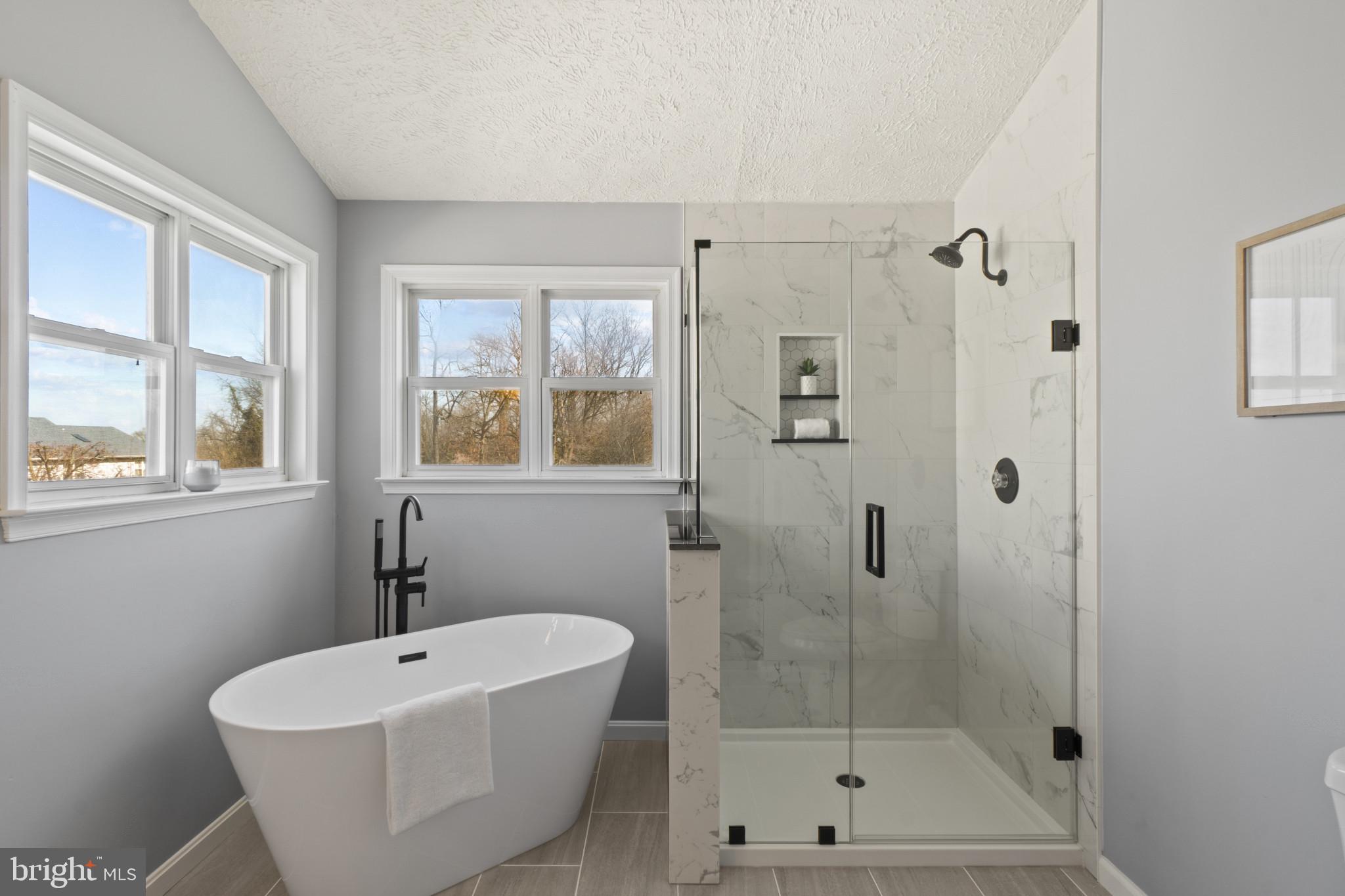 607 Brentwood Road Linthicum Heights, MD 21090 - Photo 25 of 31 a bathroom with a white bath tub a shower and a sink