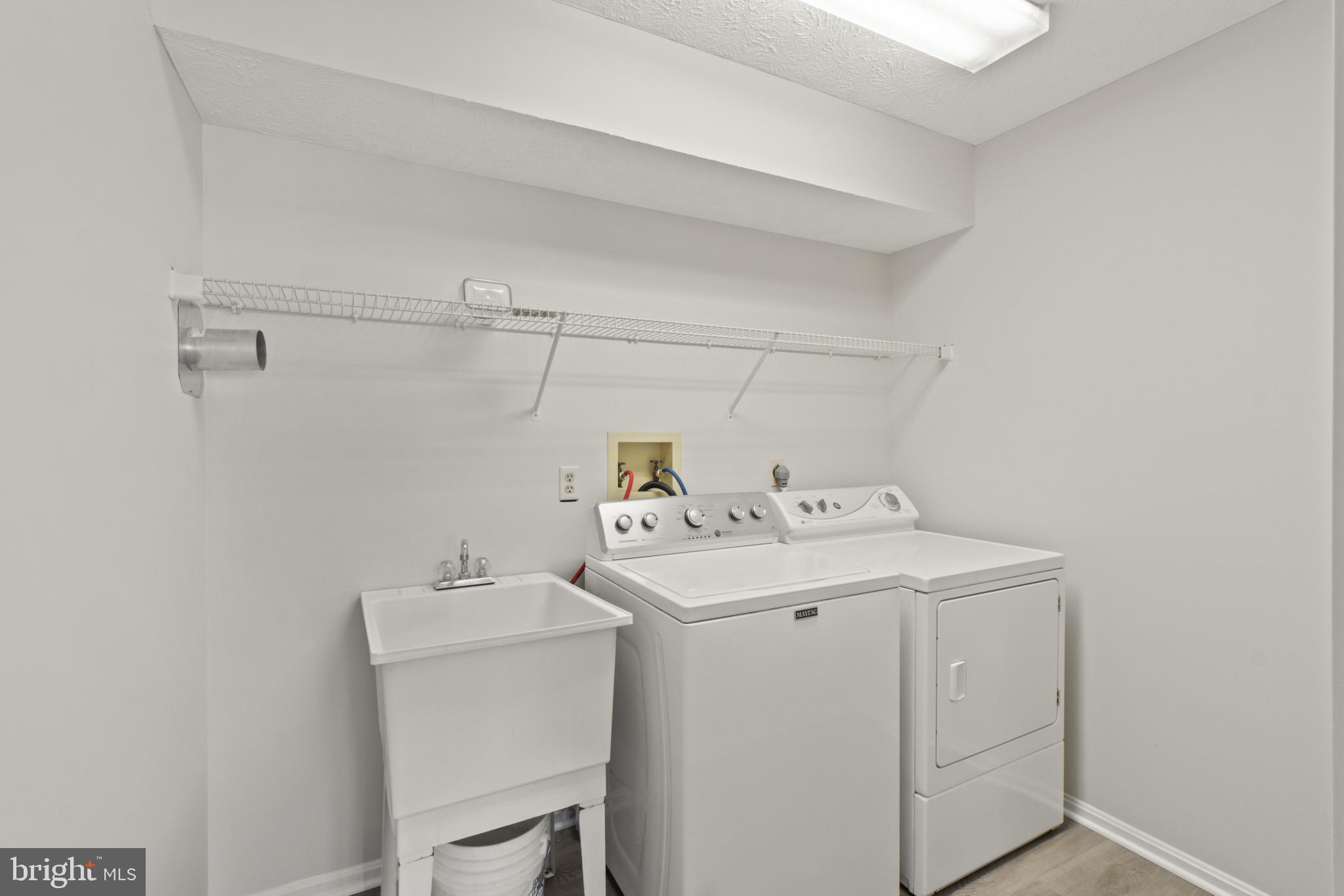 607 Brentwood Road Linthicum Heights, MD 21090 - Photo 26 of 31 a utility room with dryer and washer