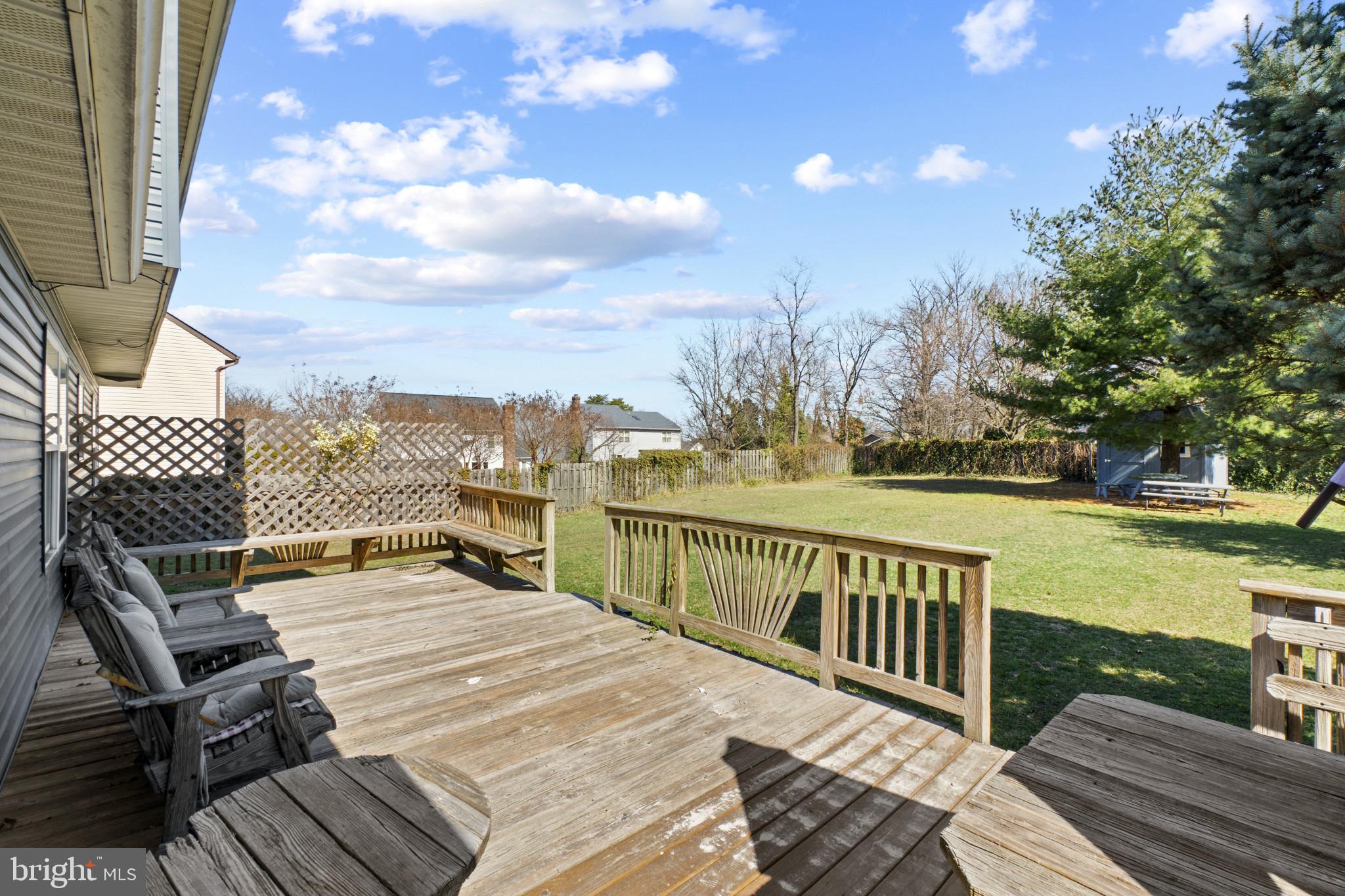607 Brentwood Road Linthicum Heights, MD 21090 - Photo 28 of 31 a view of a balcony with wooden floor and iron fence