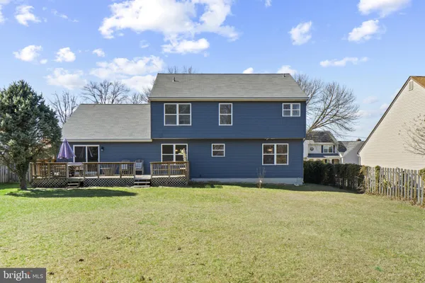 a front view of a house with a yard and a garage