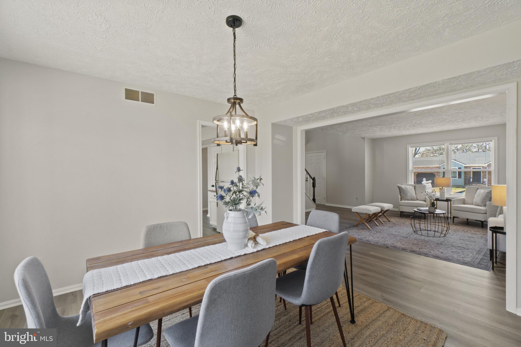 607 Brentwood Road Linthicum Heights, MD 21090 - Photo 6 of 31 a view of a dining room with furniture wooden floor and chandelier