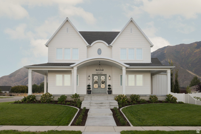 415 South 1200 West Mapleton, UT 84664 - Photo 1 of 1 View of front facade with a mountain view, covered porch, french doors, and a shingled roof