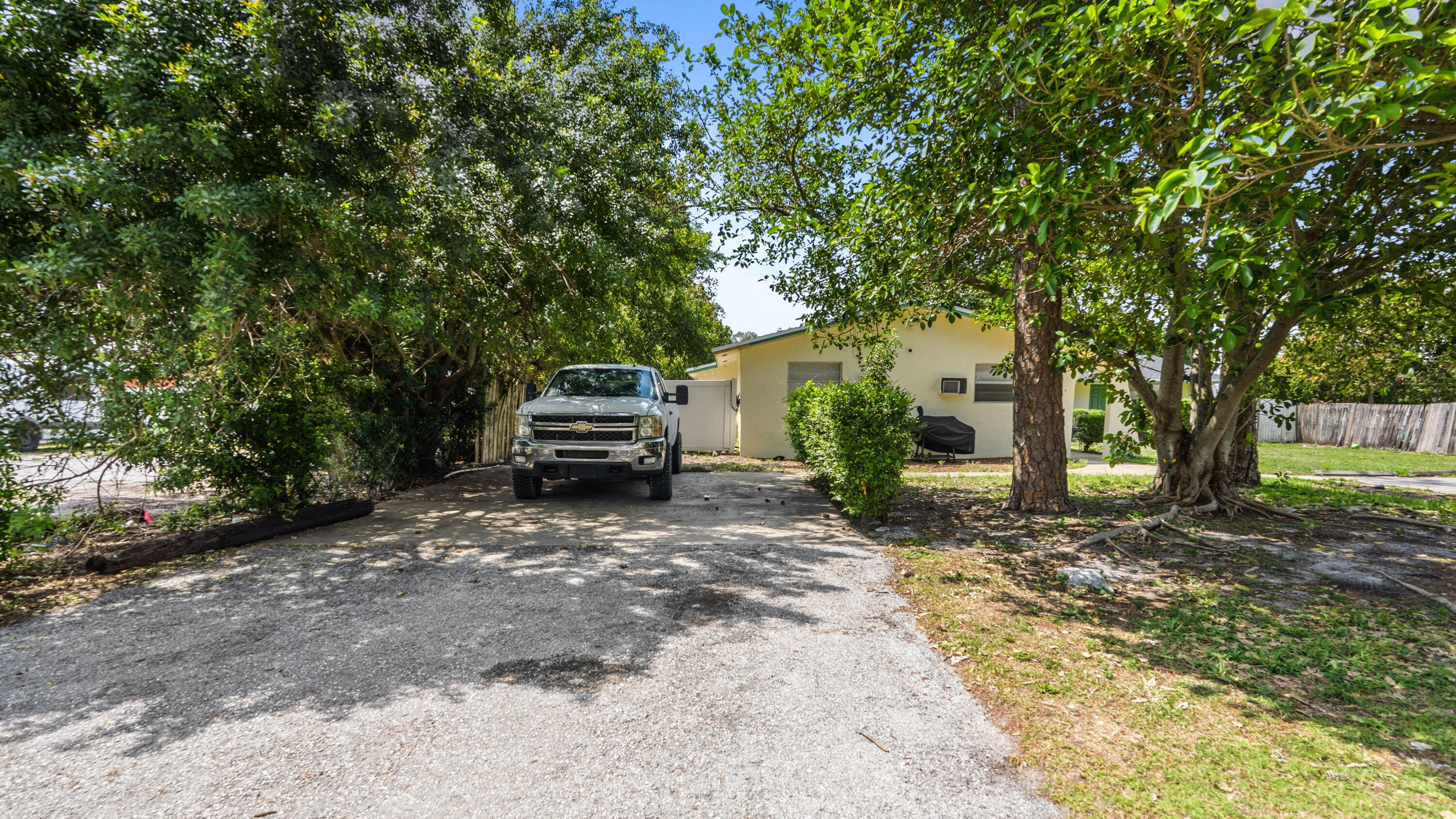 4453 Stevens Road Lake Worth Beach, FL 33461 - Photo 26 of 67 a view of a car parked in front of a house