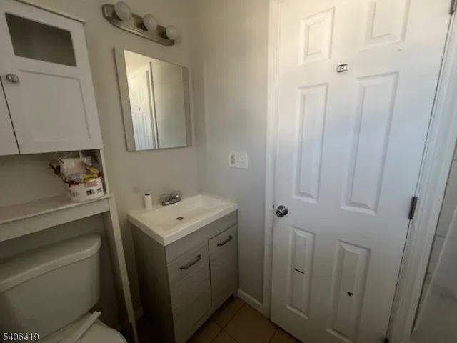a bathroom with a sink toilet and vanity