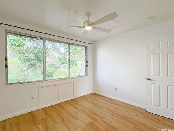 a view of an empty room with a window