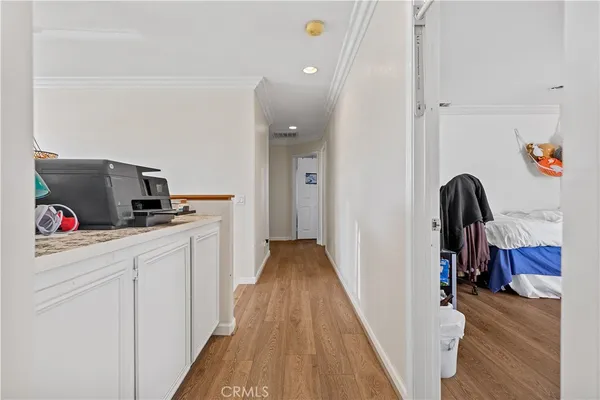 a view of a kitchen from the hallway