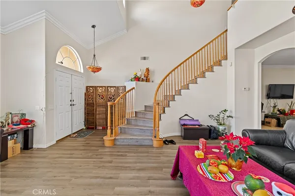 a living room with lots of furniture and a wooden floor