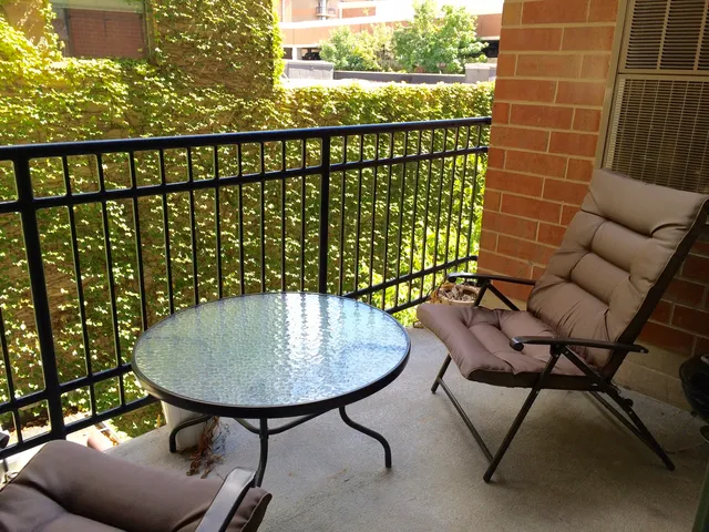 a view of a chairs and table in patio