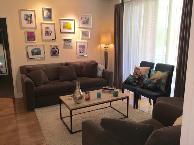 a living room with furniture and a window