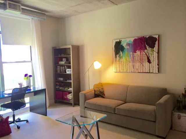 a living room with furniture and a window