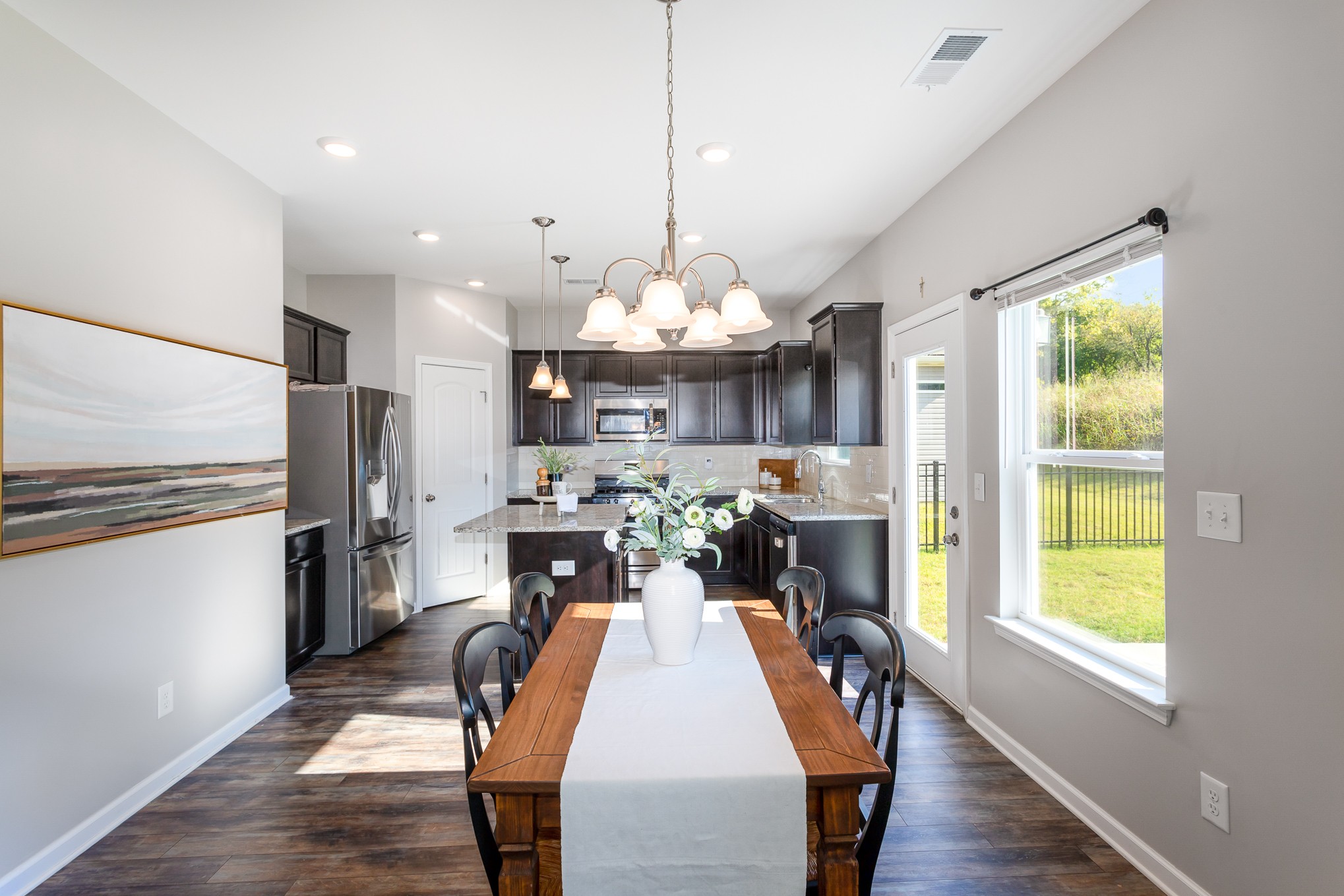 525 Burchell Lane Columbia, TN 38401 - Photo 11 of 35 a view of a dining room and livingroom with furniture window and wooden floor