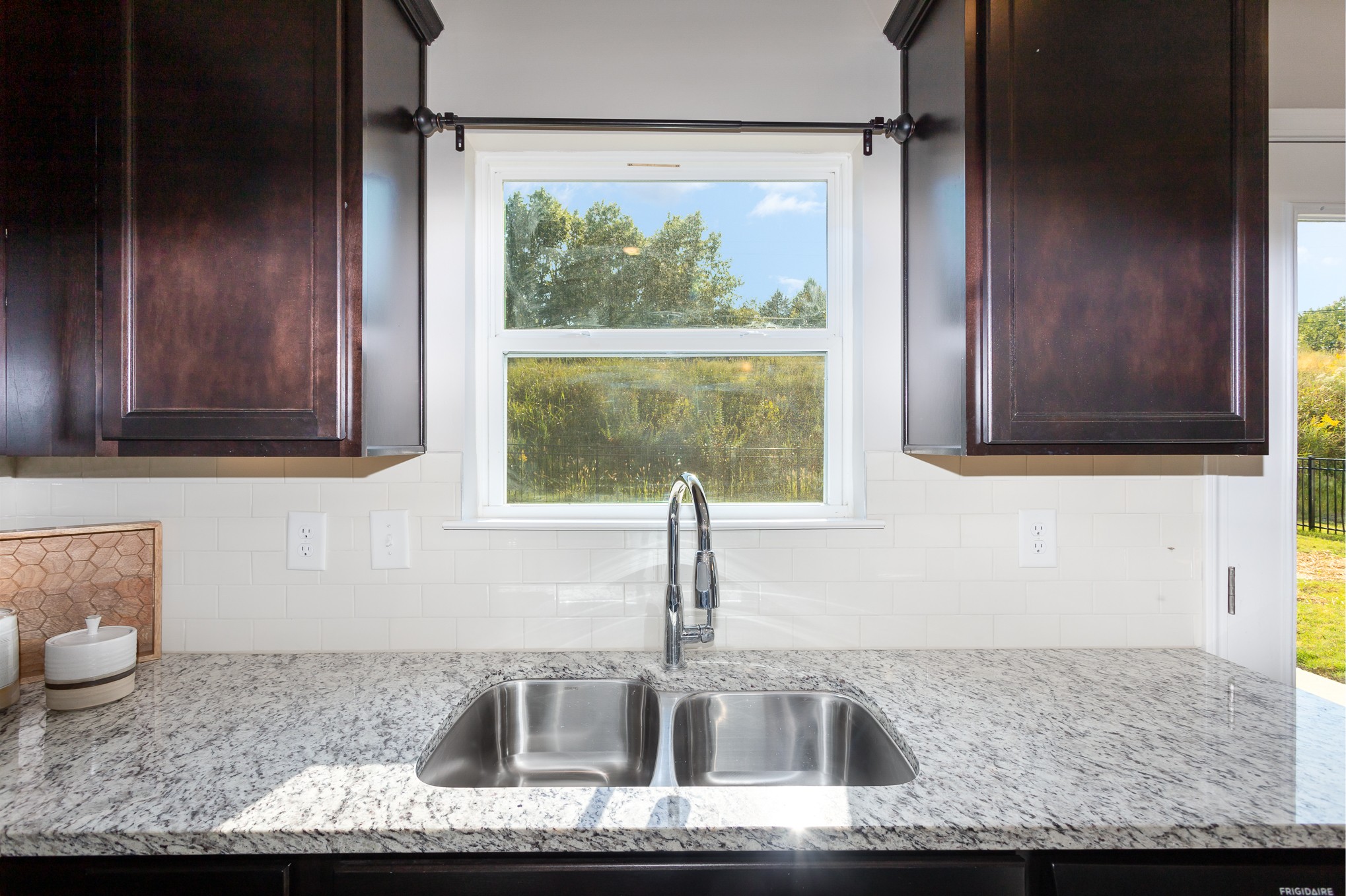 525 Burchell Lane Columbia, TN 38401 - Photo 15 of 35 a kitchen with granite countertop a sink and a wooden floor